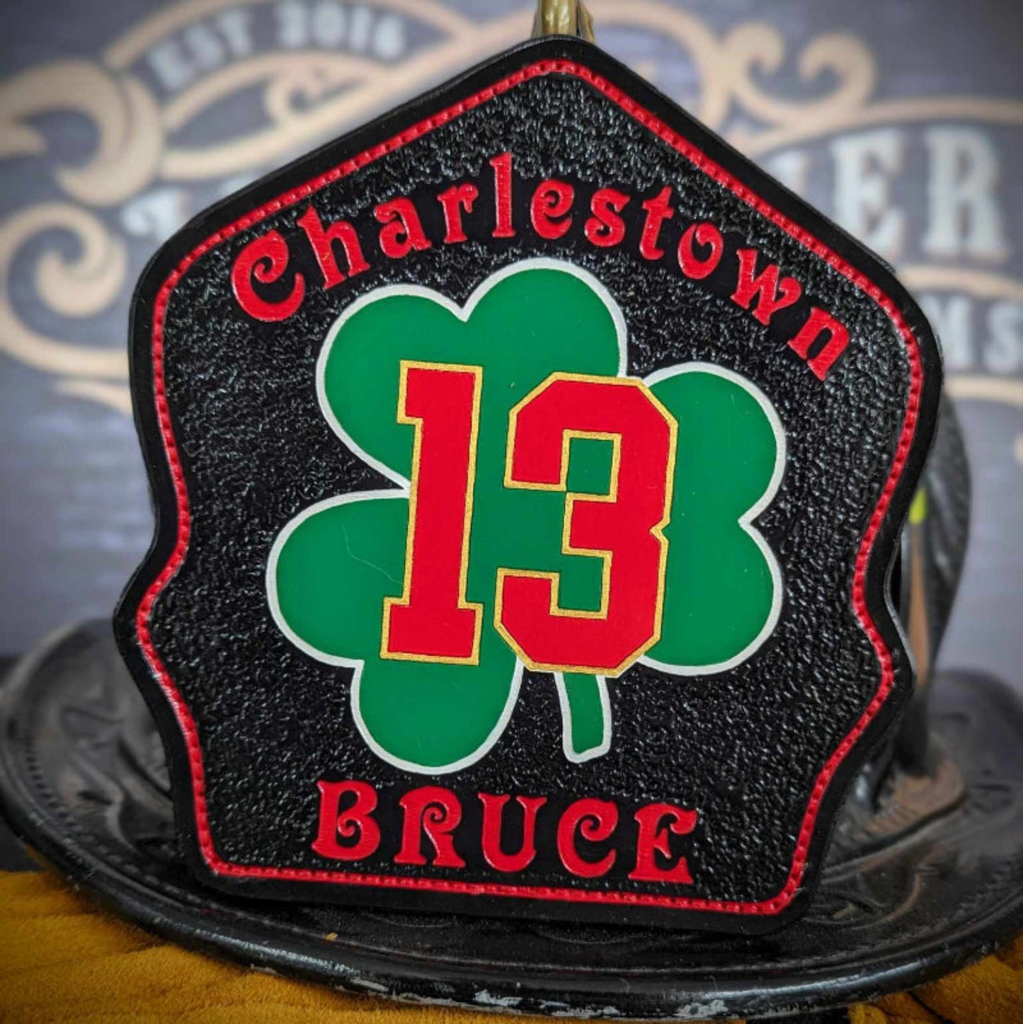 Custom Leather fire helmet shield with department name, rank, and company number