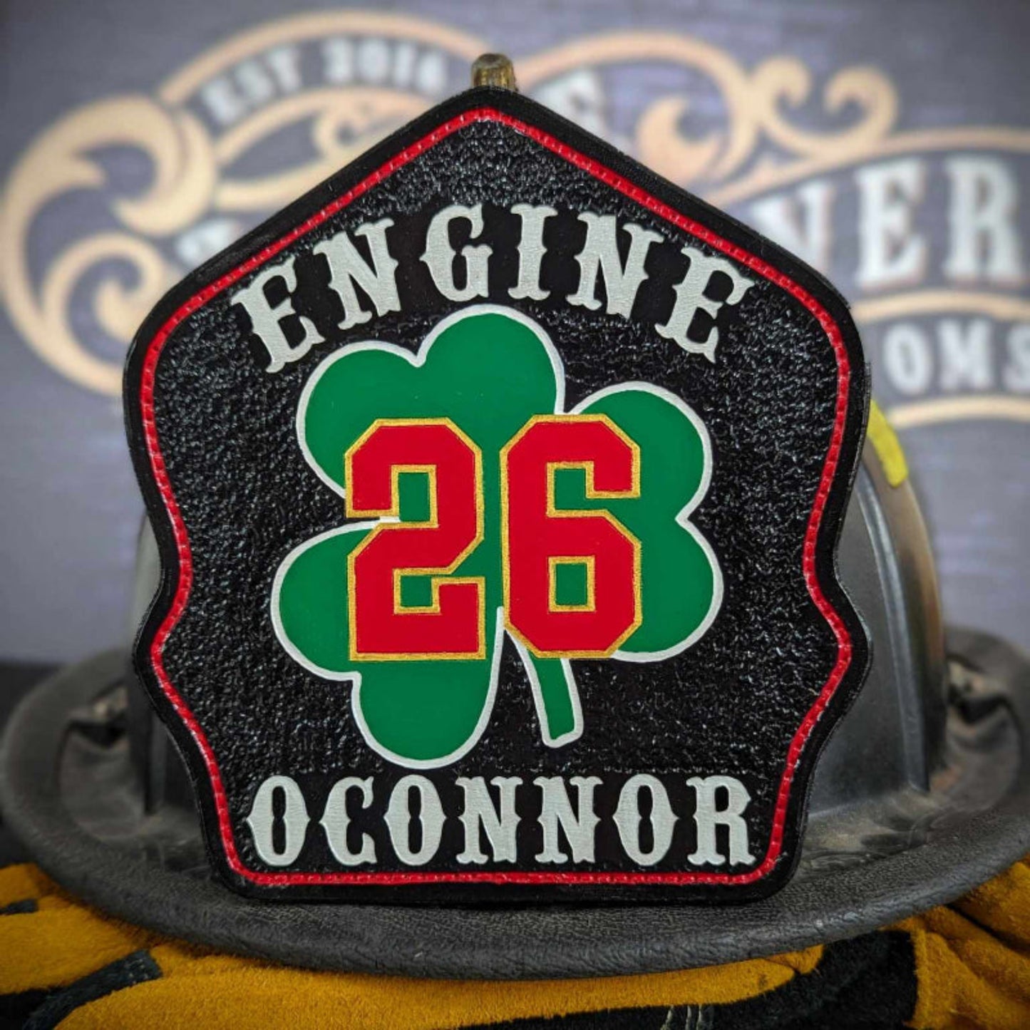Custom Leather fire helmet shield with department name, rank, and company number