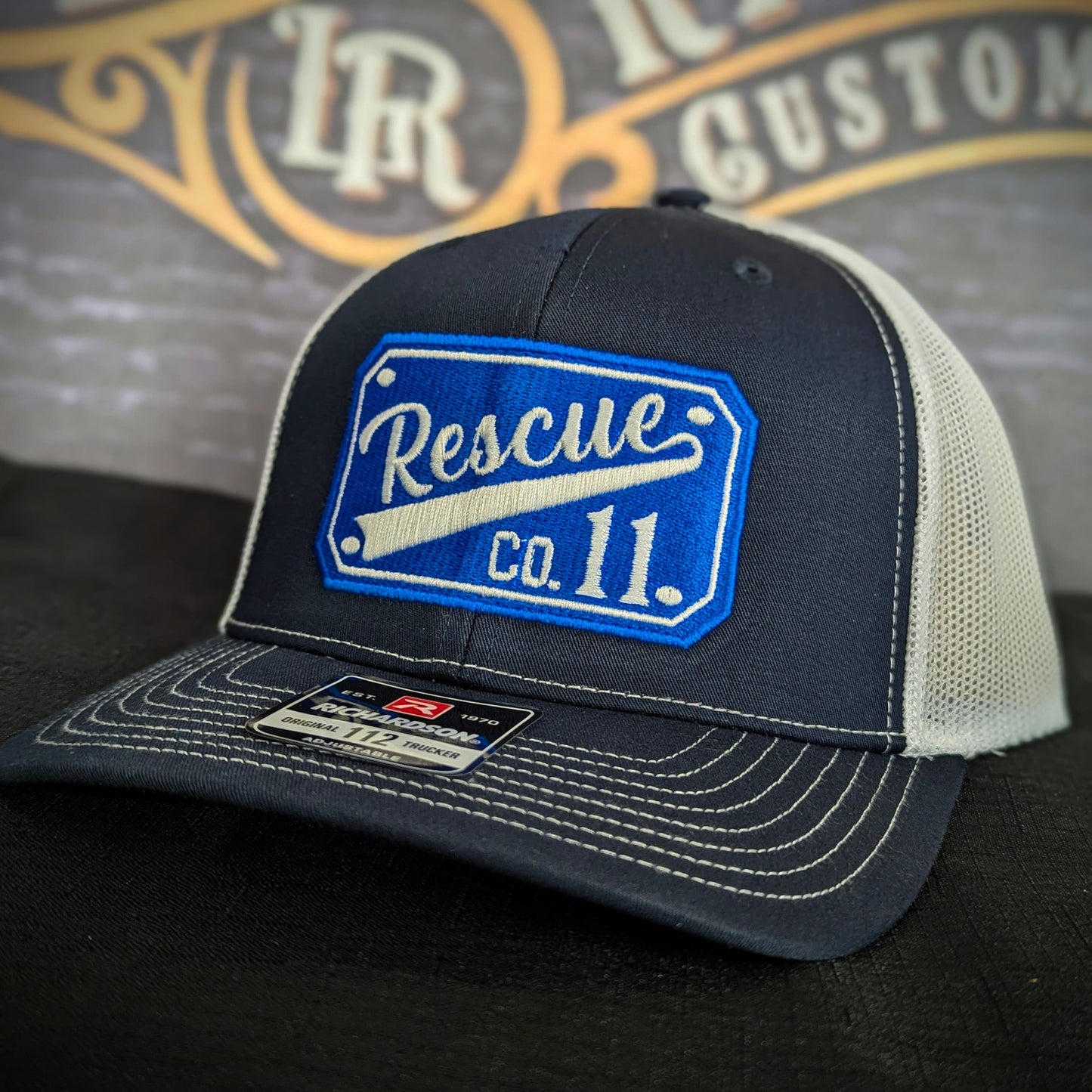 Custom embroidered firefighter hat with bold stitching, structured fit, and premium Richardson snapback design