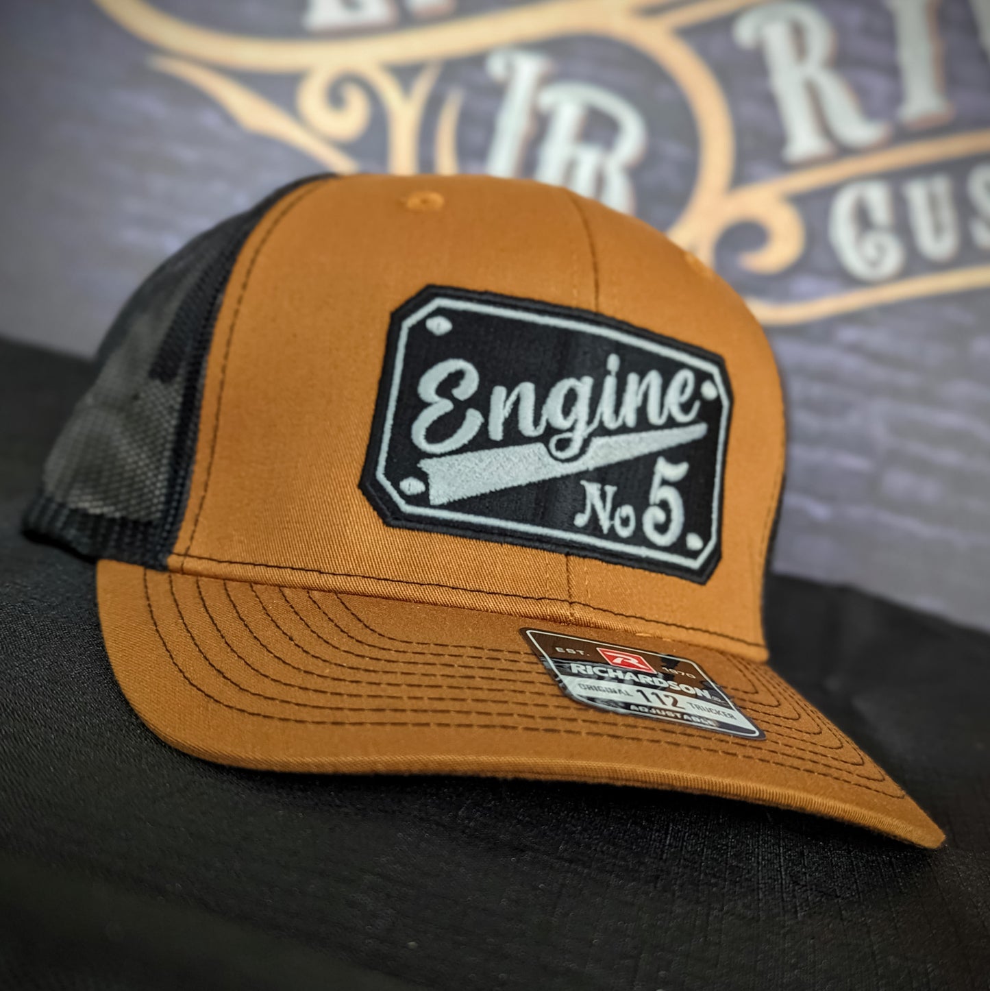 Custom embroidered firefighter hat with bold stitching, structured fit, and premium Richardson snapback design