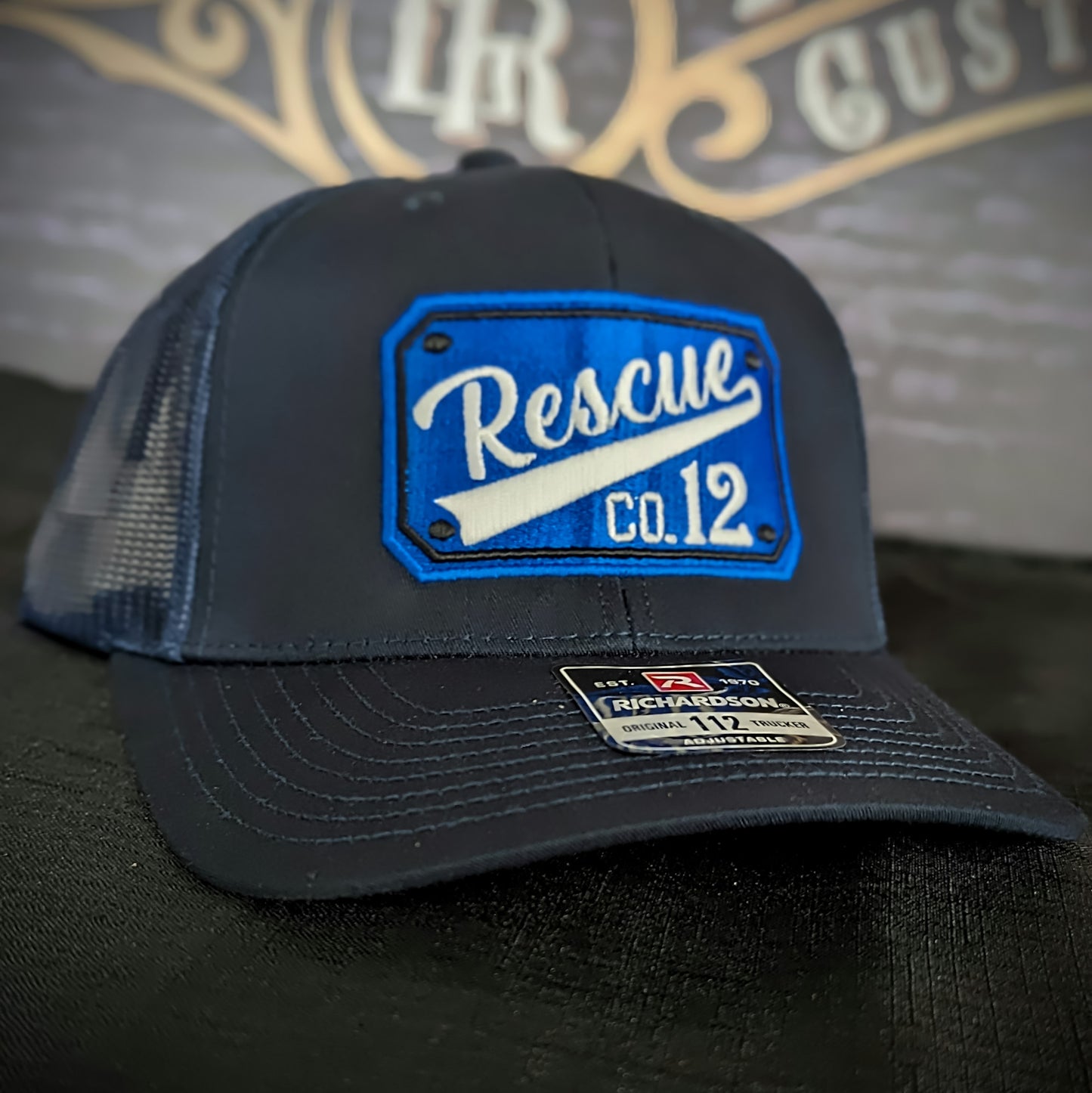 Custom embroidered firefighter hat with bold stitching, structured fit, and premium Richardson snapback design