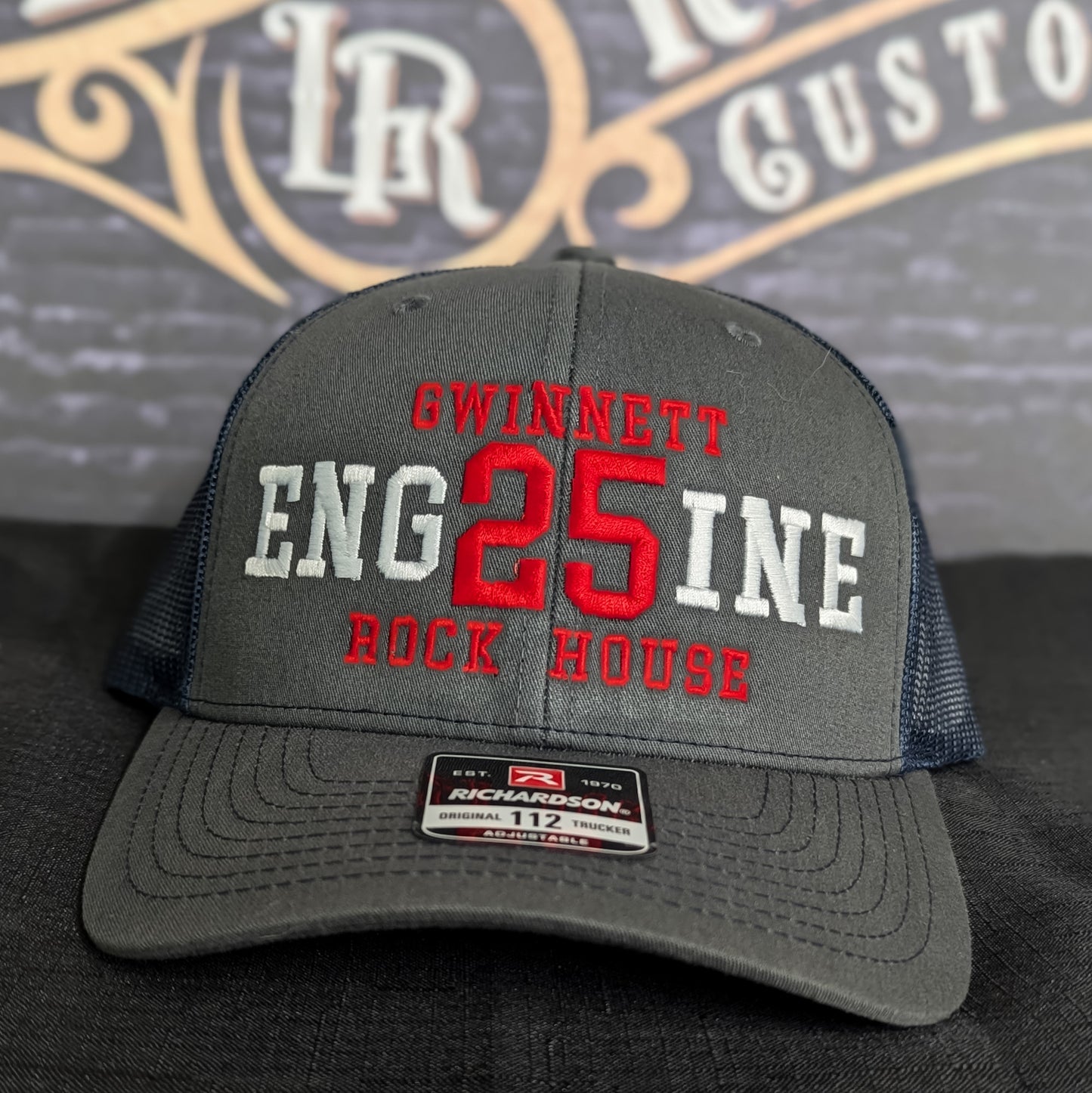 Custom embroidered firefighter hat with bold stitching, structured fit, and premium Richardson snapback design