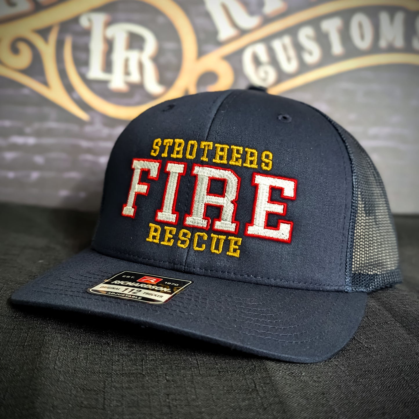Custom embroidered firefighter hat with bold stitching, structured fit, and premium Richardson snapback design