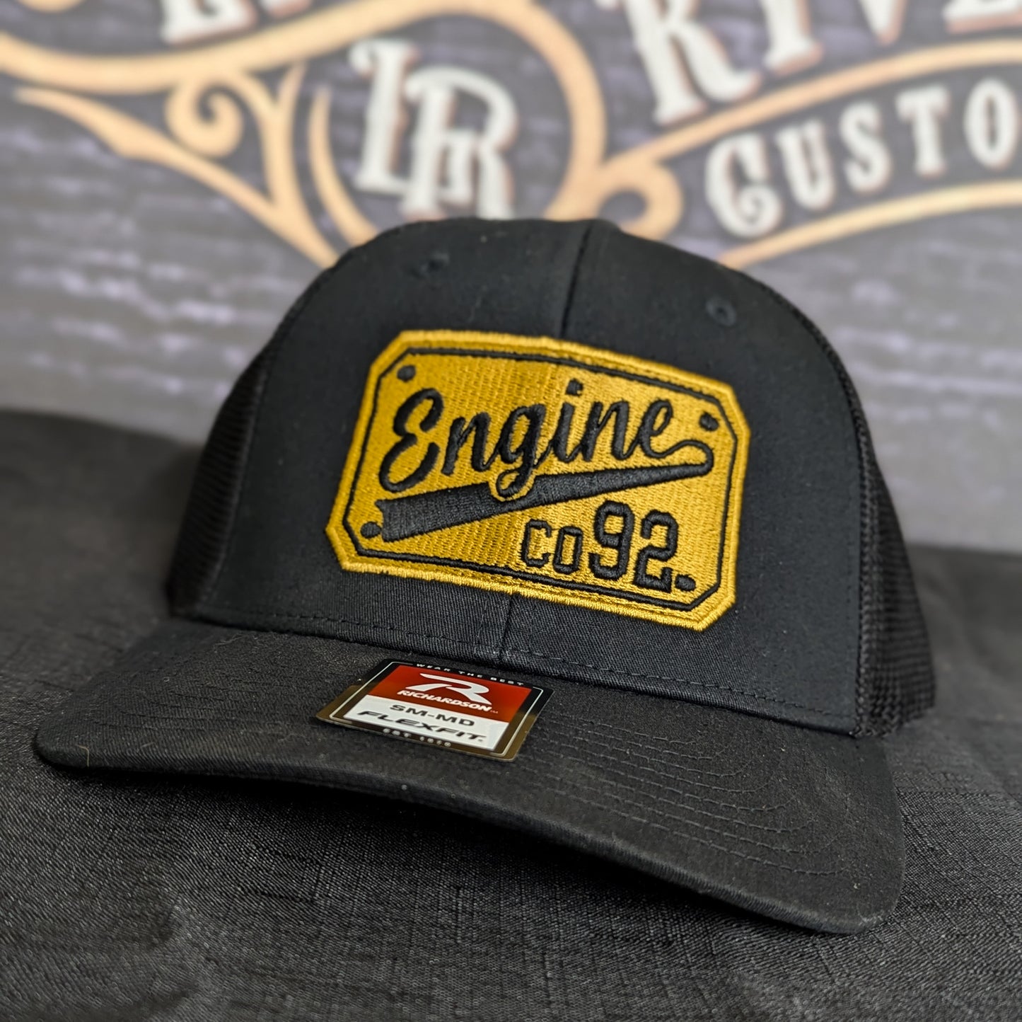 Custom embroidered firefighter hat with bold stitching, structured fit, and premium Richardson snapback design