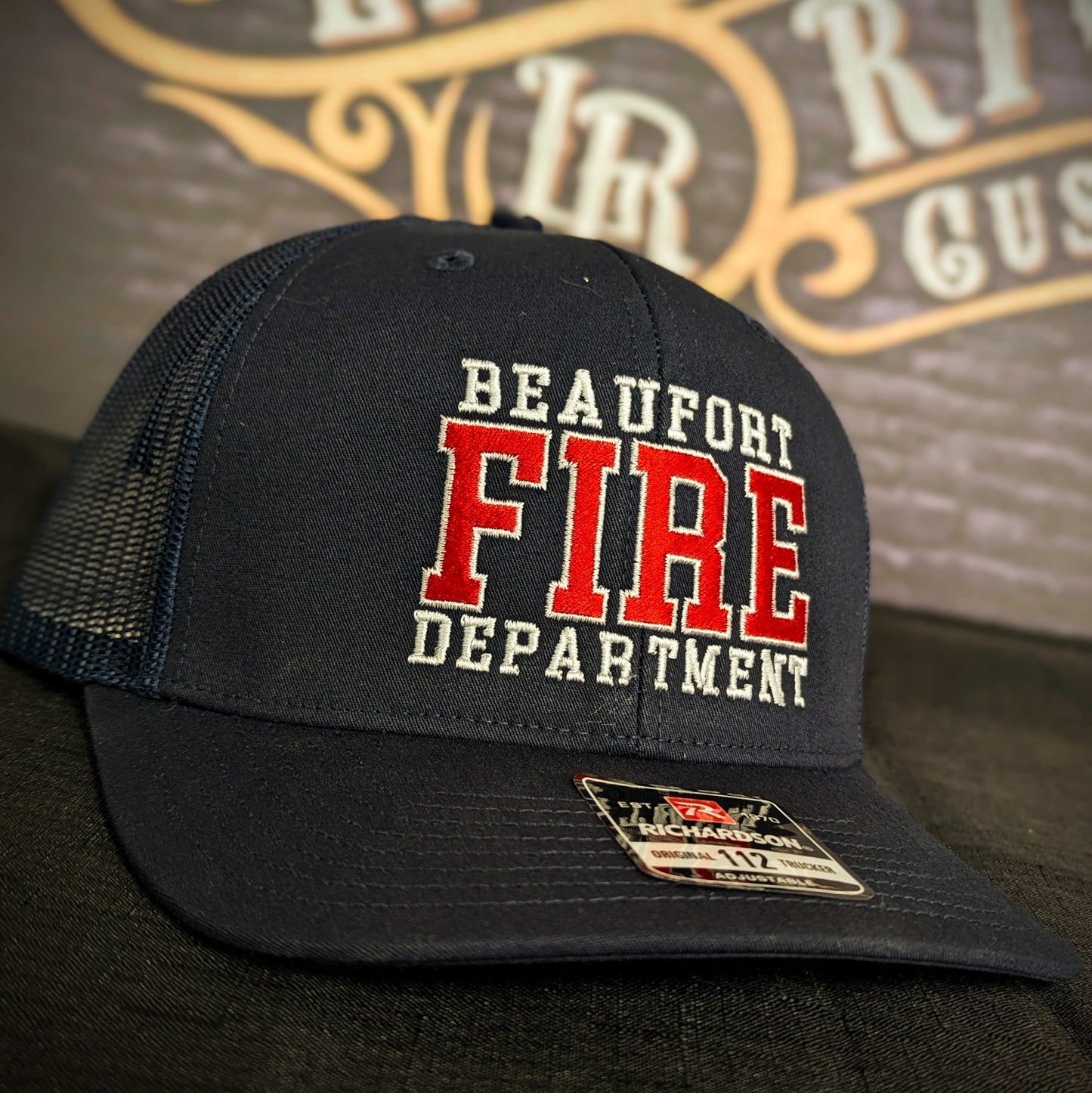 Custom embroidered firefighter hat with bold stitching, structured fit, and premium Richardson snapback design