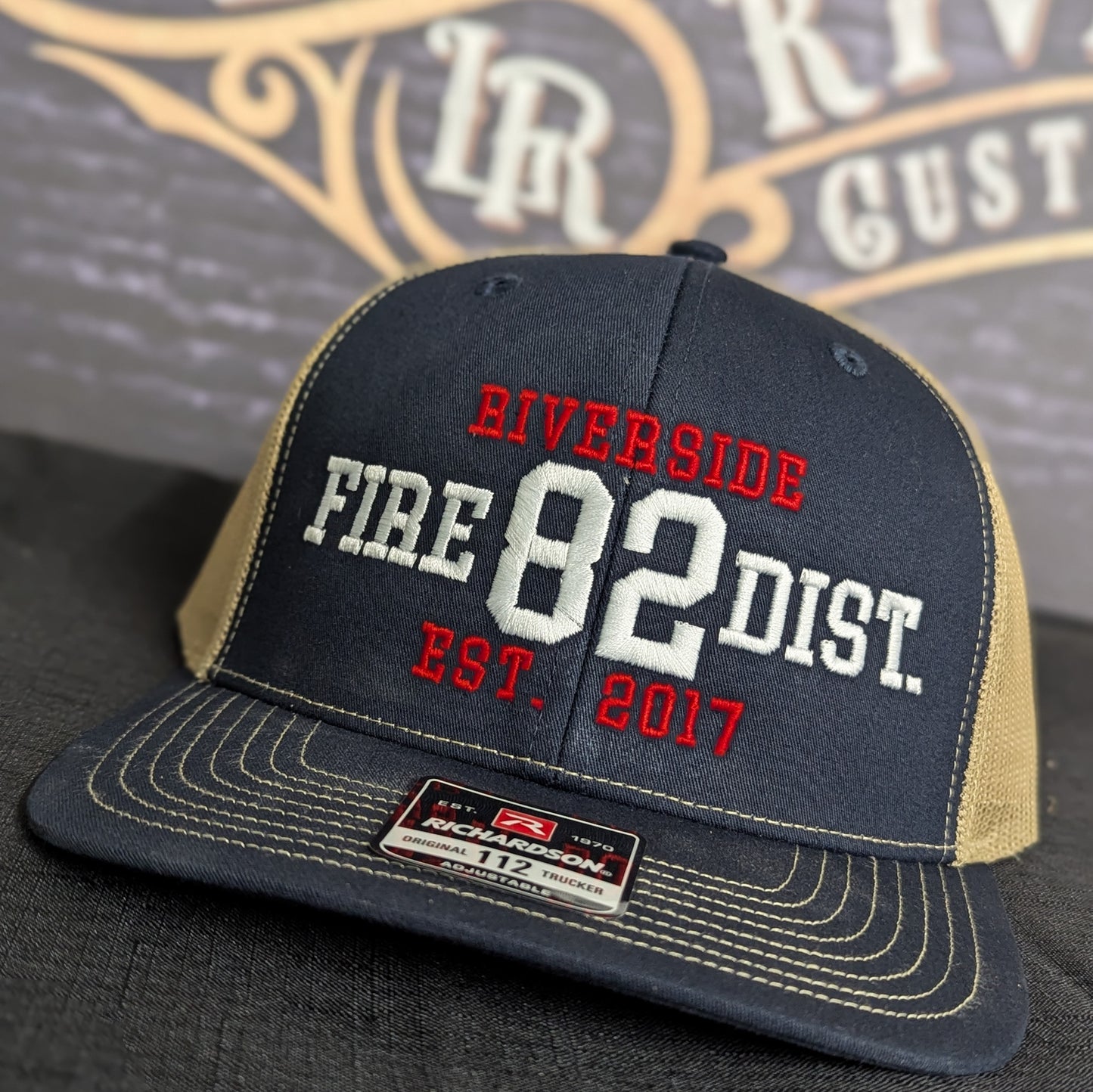 Custom embroidered firefighter hat with bold stitching, structured fit, and premium Richardson snapback design
