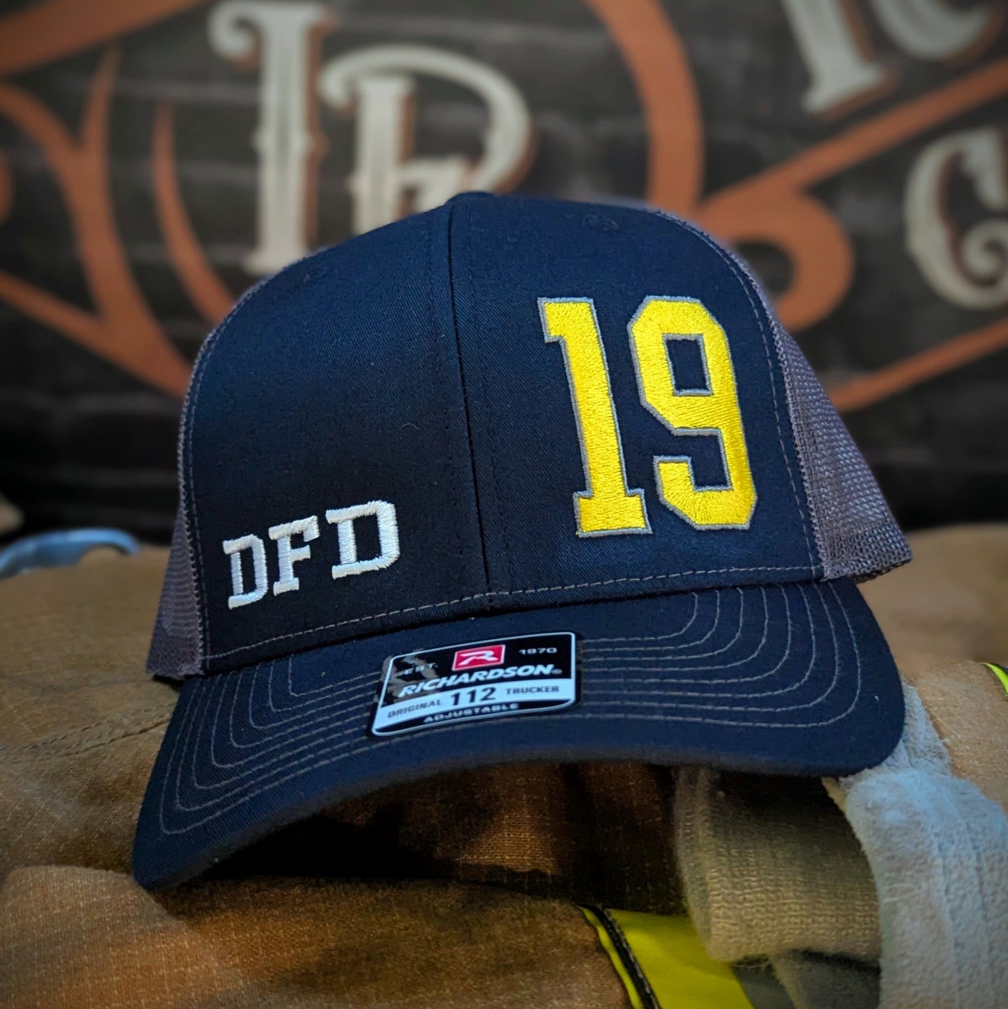 Custom embroidered firefighter hat with bold stitching, structured fit, and premium Richardson snapback design