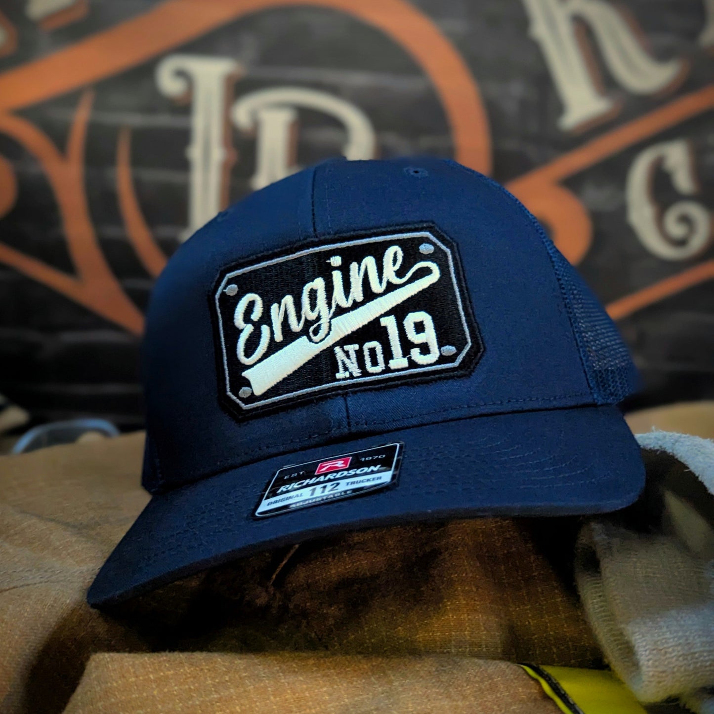 Custom embroidered firefighter hat with bold stitching, structured fit, and premium Richardson snapback design