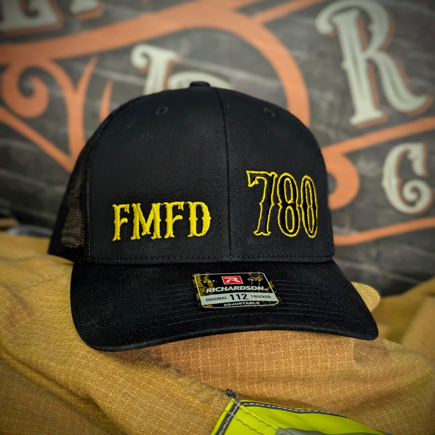 Custom embroidered firefighter hat with bold stitching, structured fit, and premium Richardson snapback design