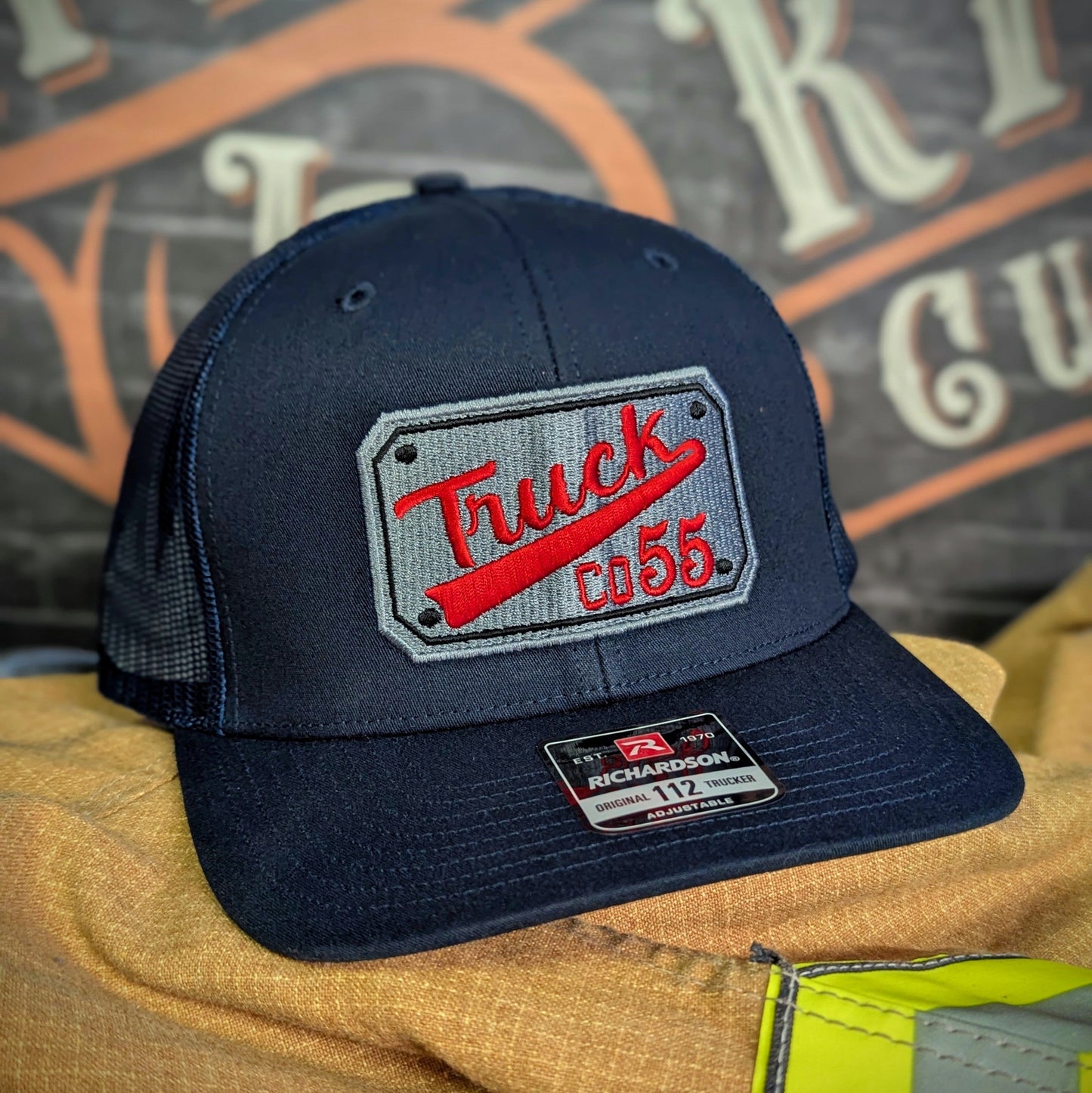 Custom embroidered firefighter hat with bold stitching, structured fit, and premium Richardson snapback design