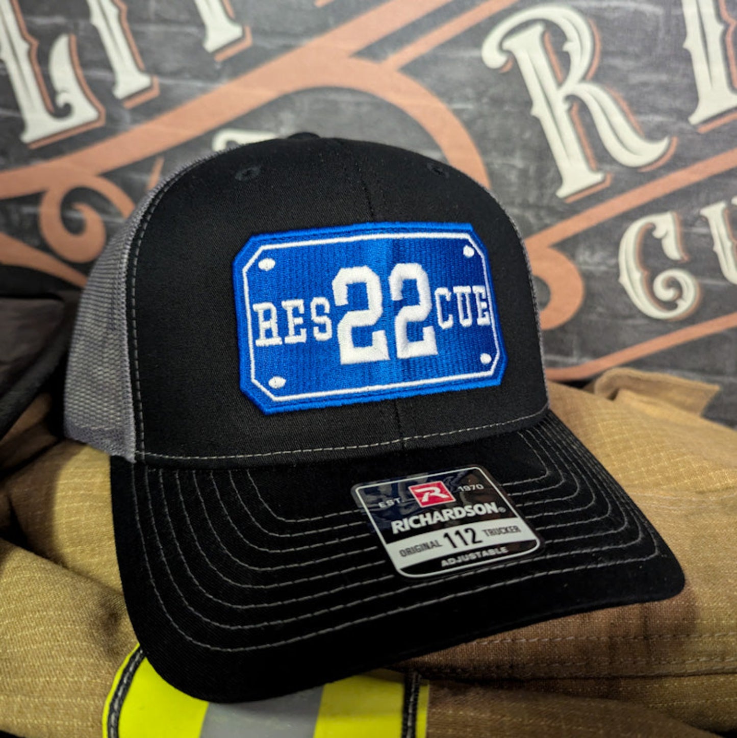 Custom embroidered firefighter hat with bold stitching, structured fit, and premium Richardson snapback design