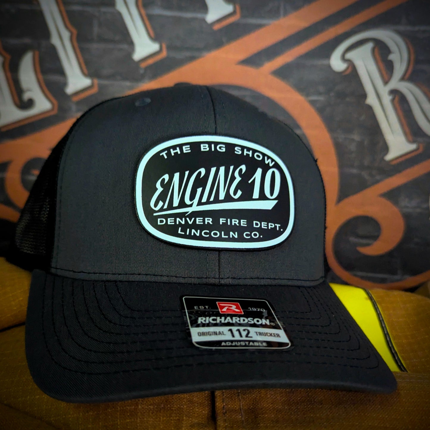 Custom firefighter hats with department logos, station numbers, or rank, featuring leather patches or embroidery on Richardson caps for fire department crews.
