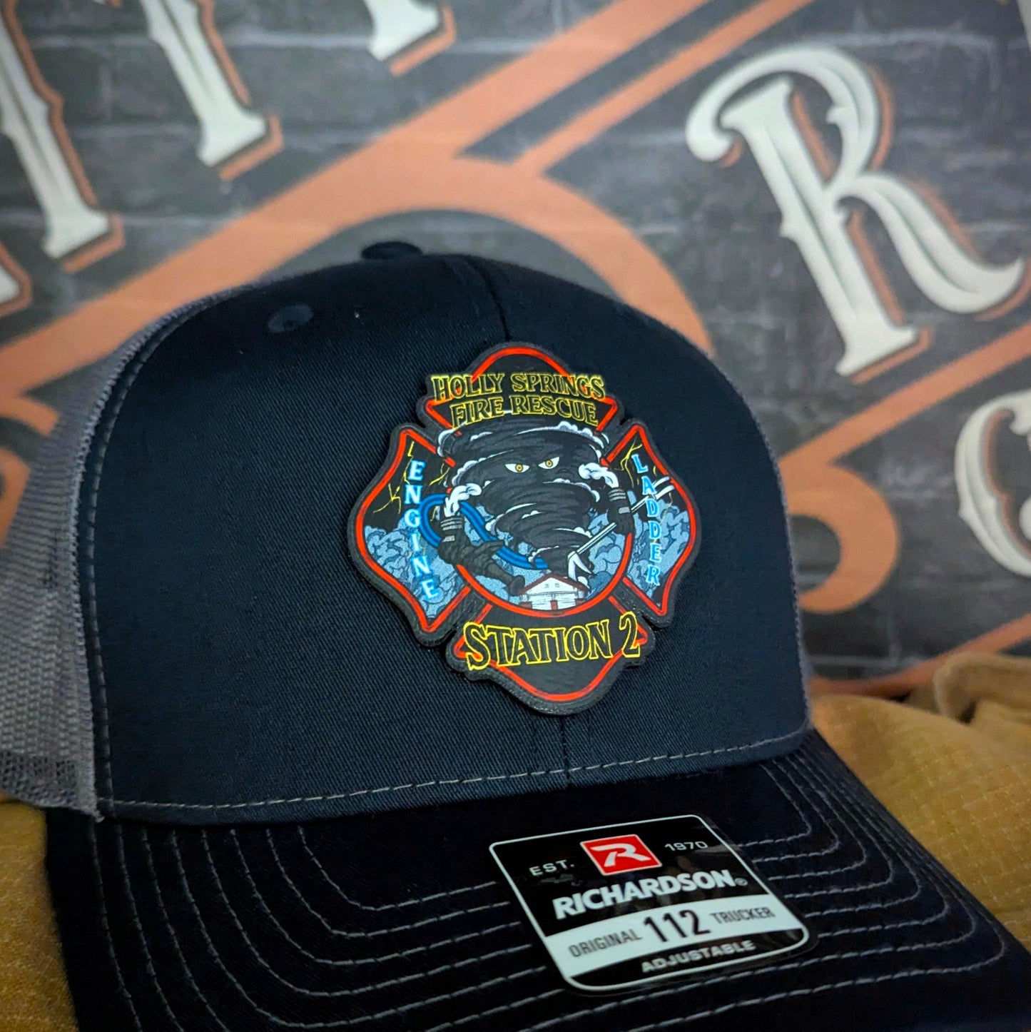 Custom firefighter hats with department logos, station numbers, or rank, featuring leather patches or embroidery on Richardson caps for fire department crews.