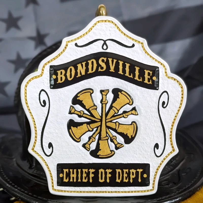 Firefighter helmet front with officer bugles carved in leather