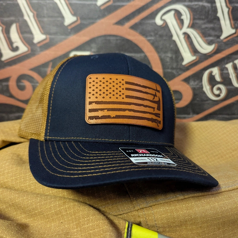 Firefighter hat featuring leather patch with American flag and fire service tools