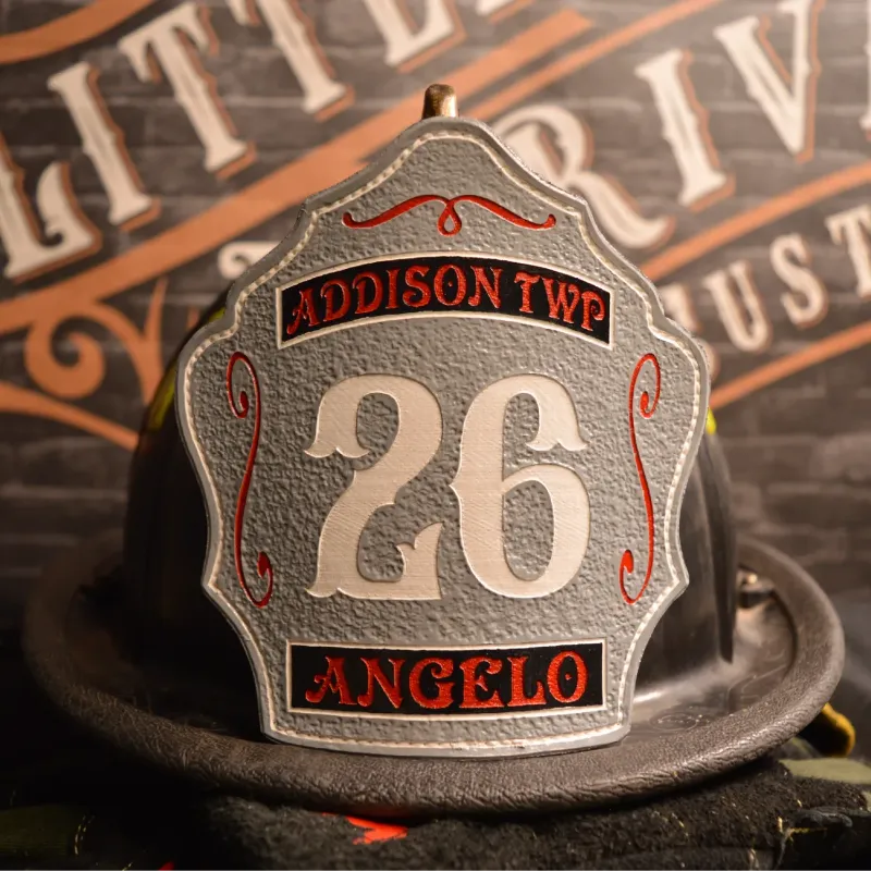 Standard Issue custom firefighter helmet shield with number 26, Addison Township lettering, and Angelo name in gray leather with red and white detailing.