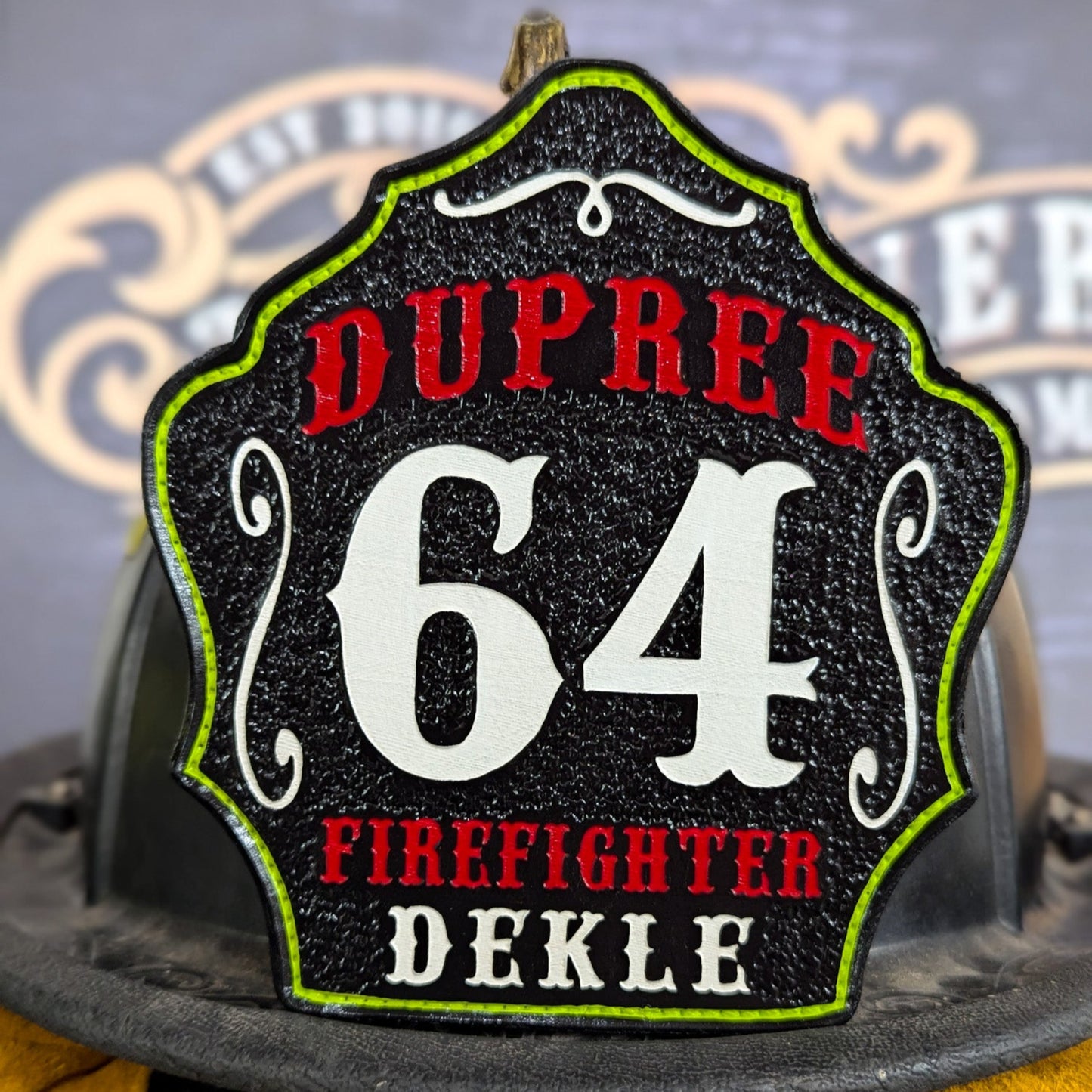 Custom leather firefighter helmet shield with Dupree lettering, large white number 64, and firefighter Dekle name.