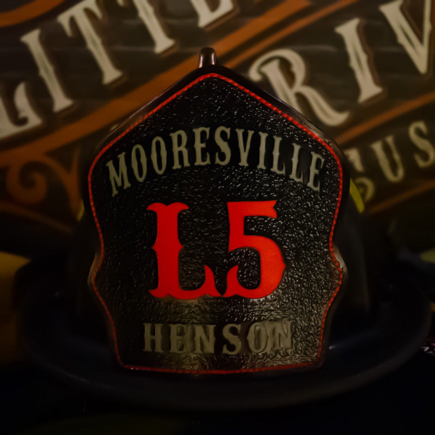 Leather firefighter helmet shield from Mooresville featuring bold red L5 lettering with personalized detail.