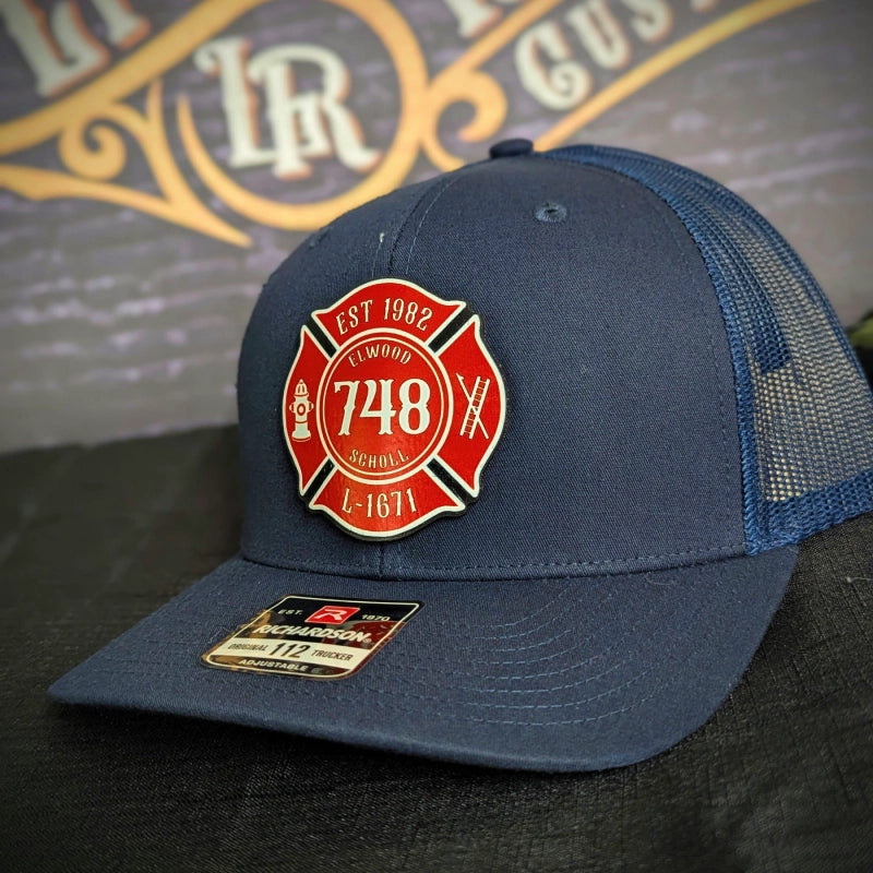 Personalized firefighter hat showing full color Maltese Cross patch