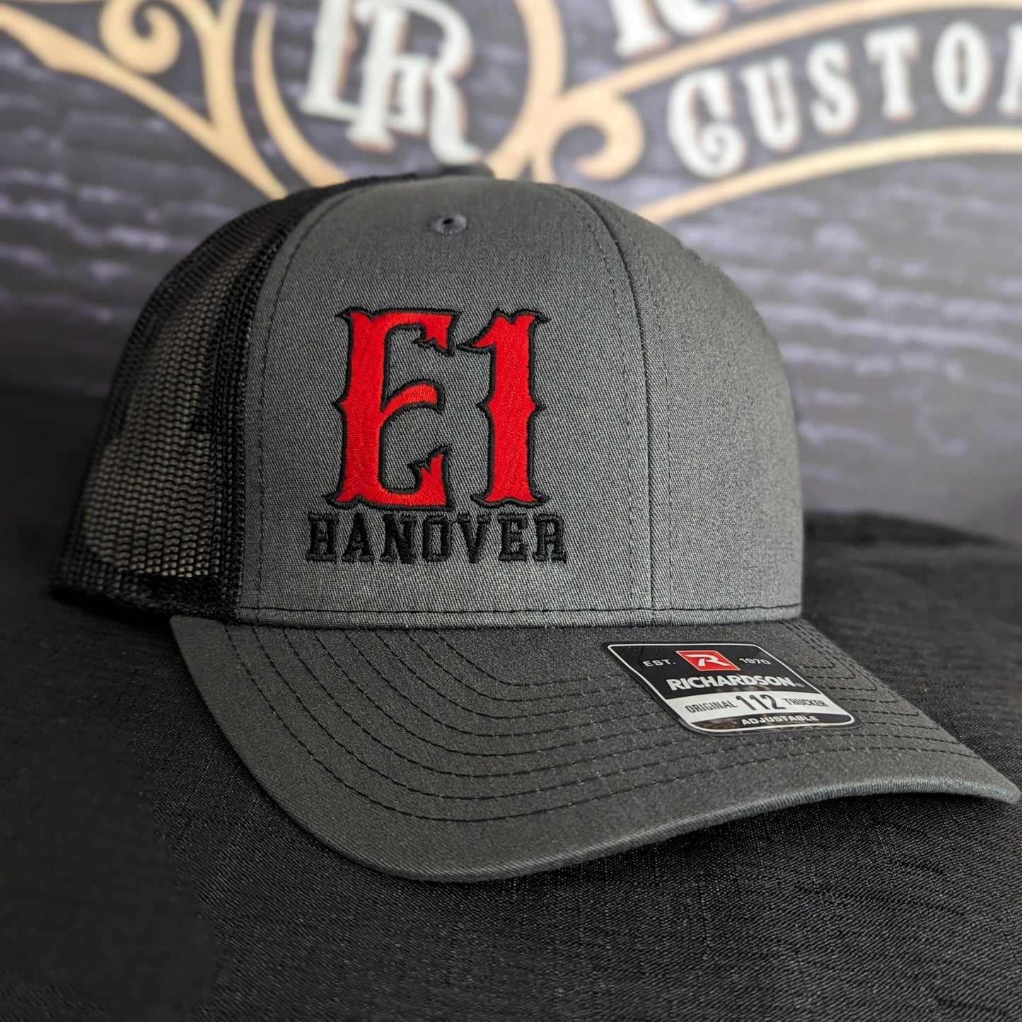 Custom embroidered firefighter hat with bold stitching, structured fit, and premium Richardson snapback design