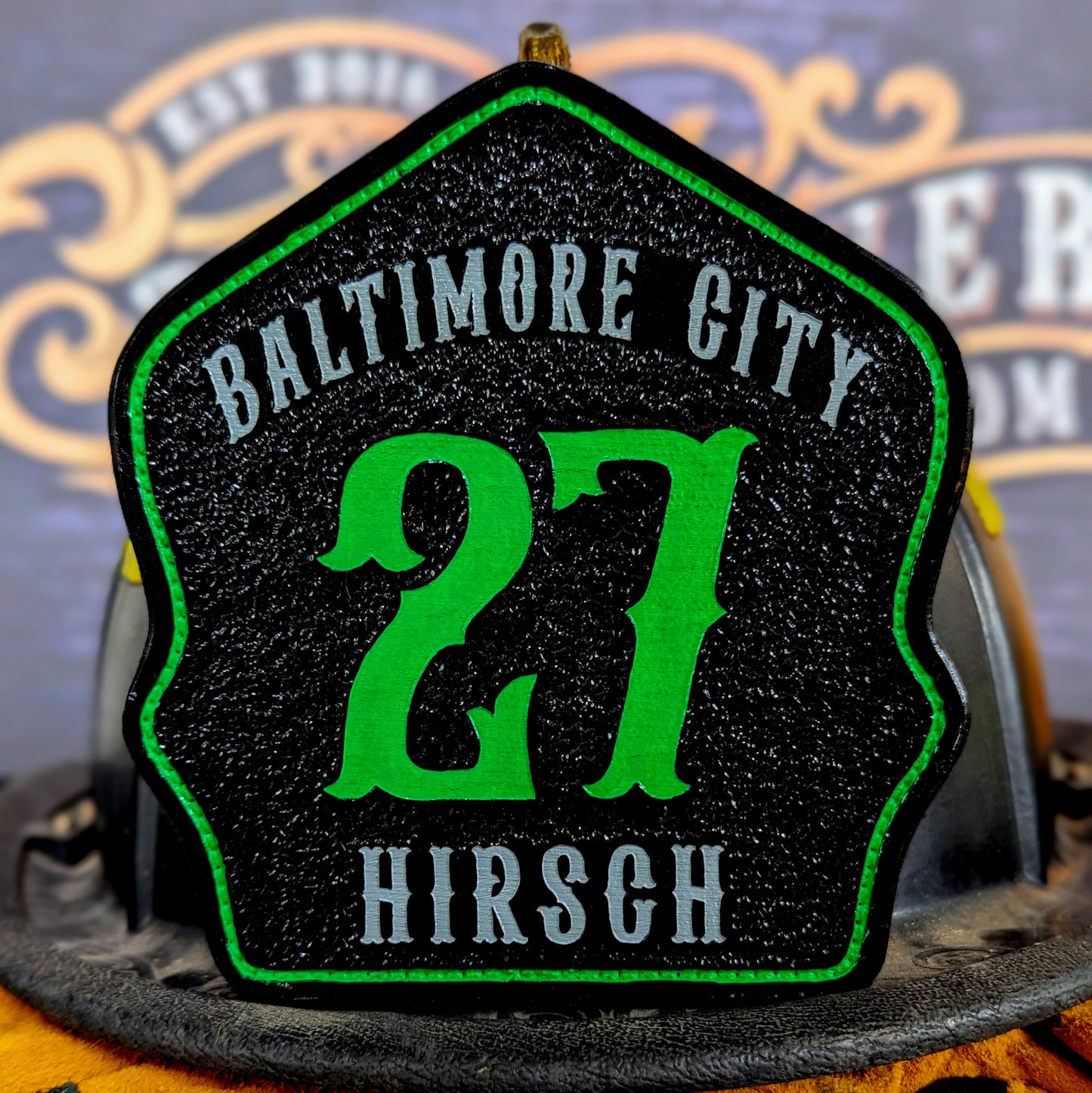 Custom leather firefighter helmet shield for Baltimore City, black with bright green 27 and Hirsch name, green outline, Little River Customs