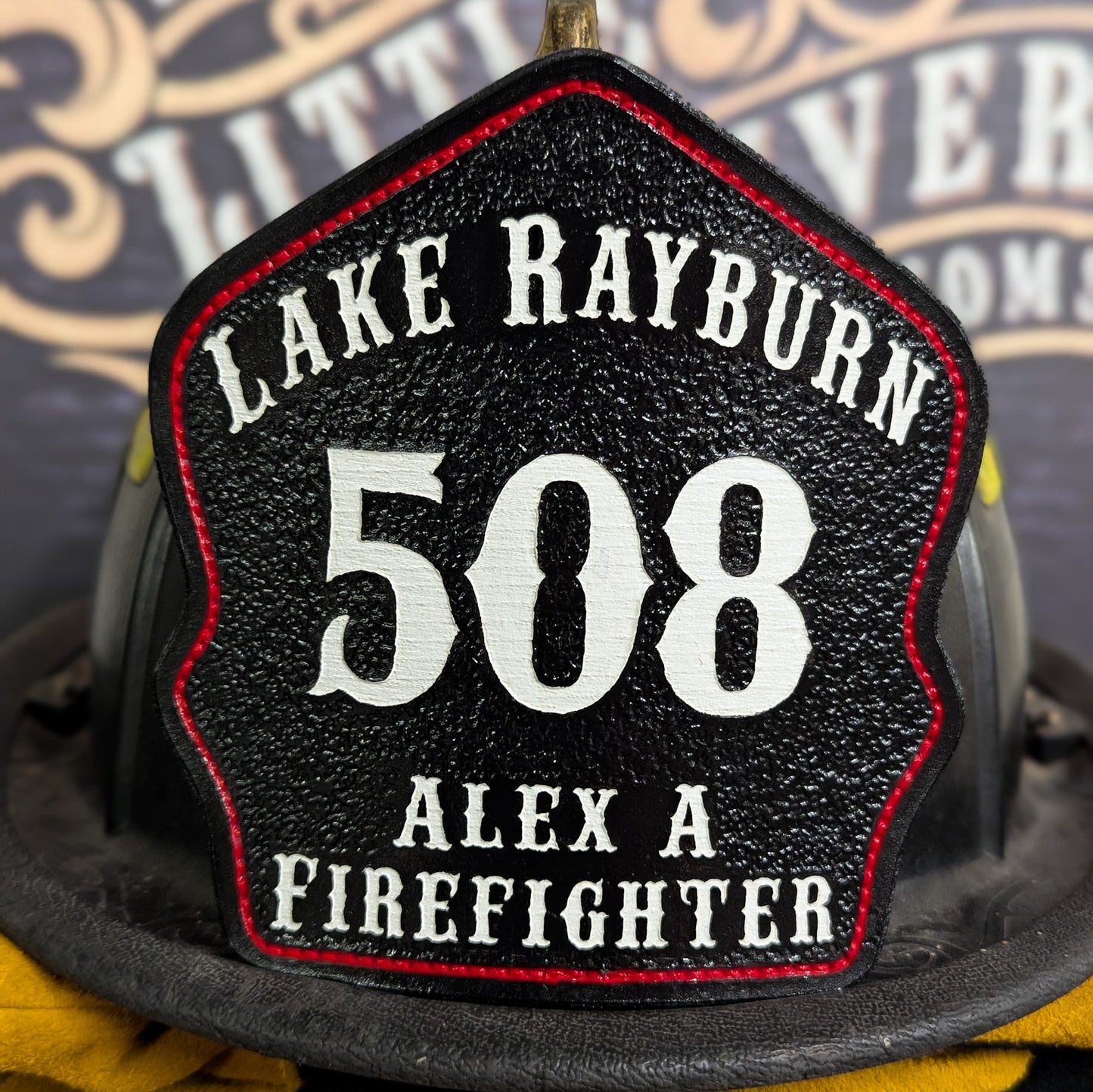 Custom leather firefighter helmet shield for Lake Rayburn, black with white 508 and “Alex A Firefighter,” red outline by Little River Customs