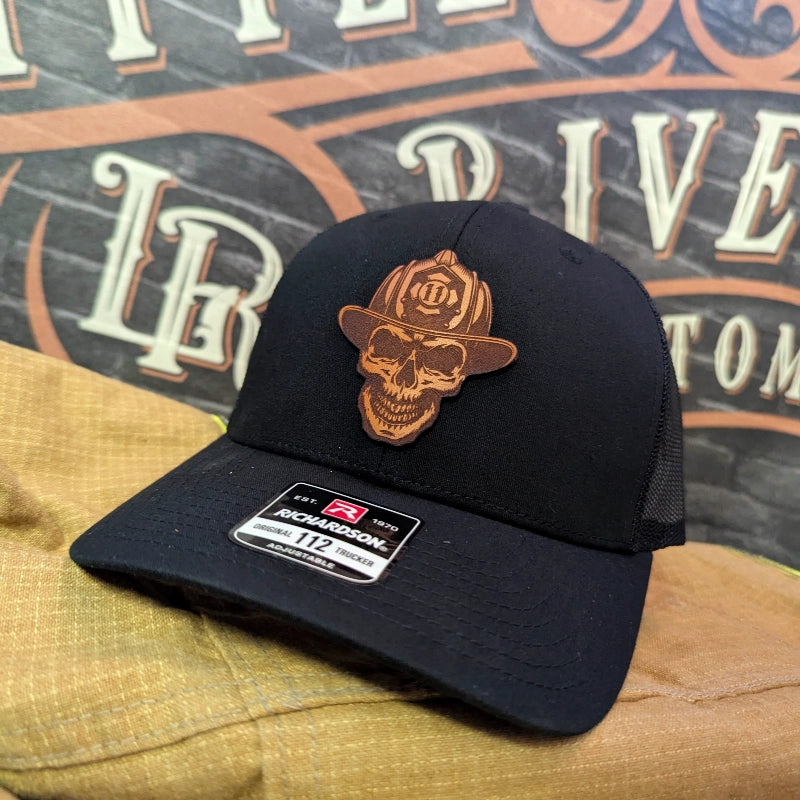 Custom firefighter hat featuring skull and helmet leather patch front