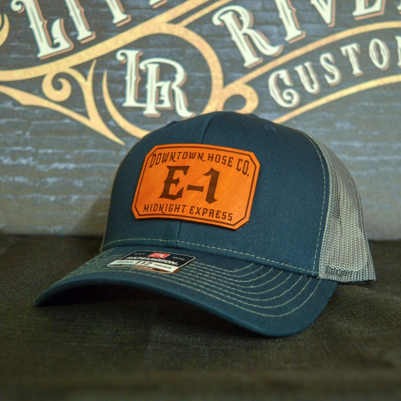 Station hat with clean passport leather patch design