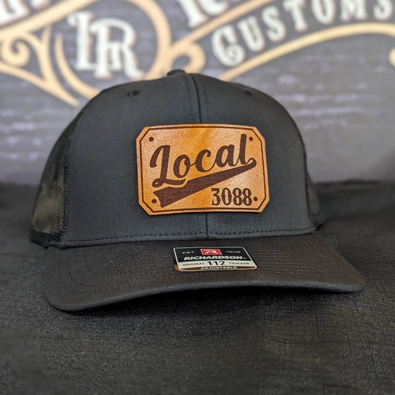 Station hat pressed with passport style leather patch