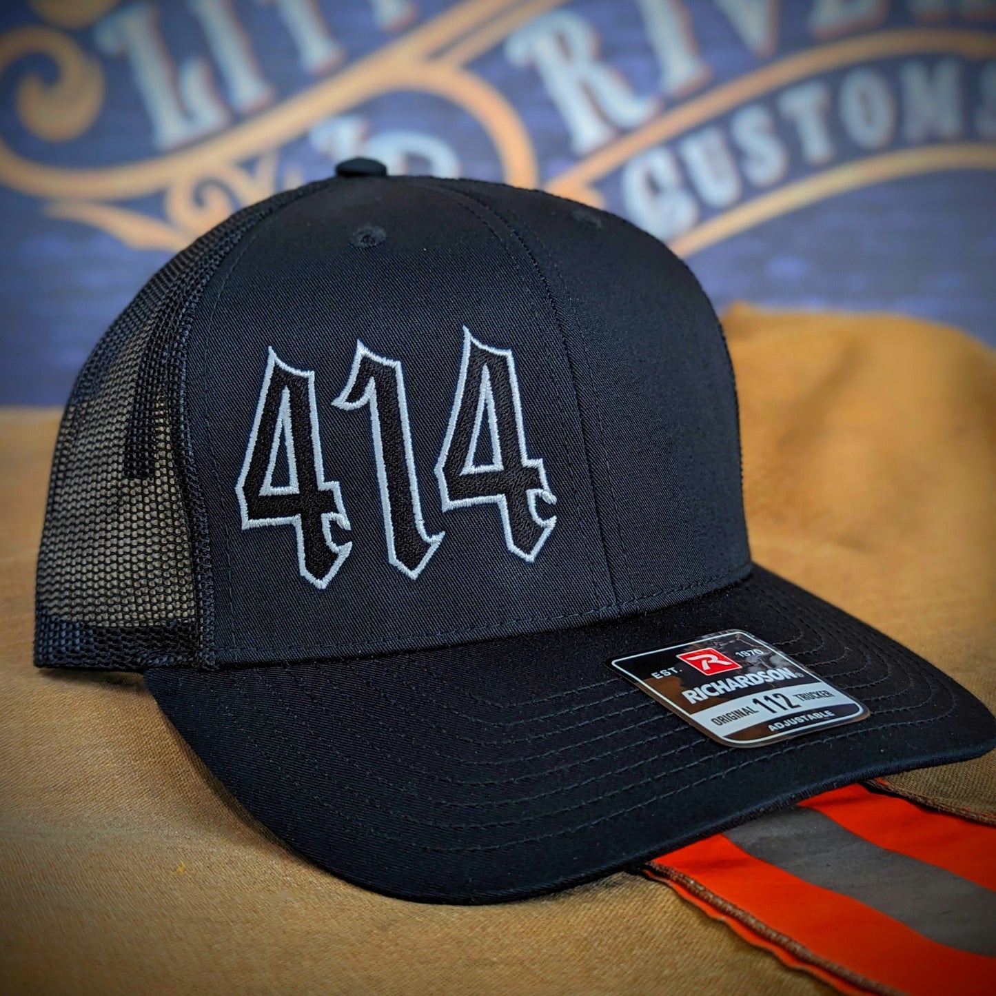 Custom embroidered firefighter hat with bold stitching, structured fit, and premium Richardson snapback design