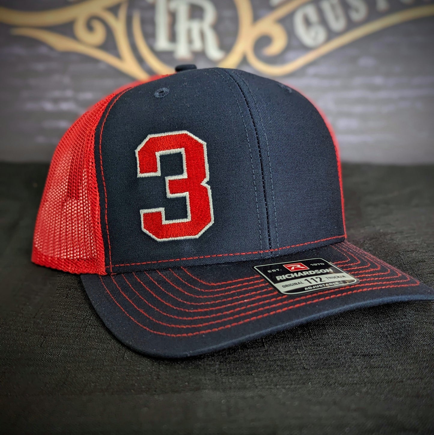 Custom embroidered firefighter hat with bold stitching, structured fit, and premium Richardson snapback design