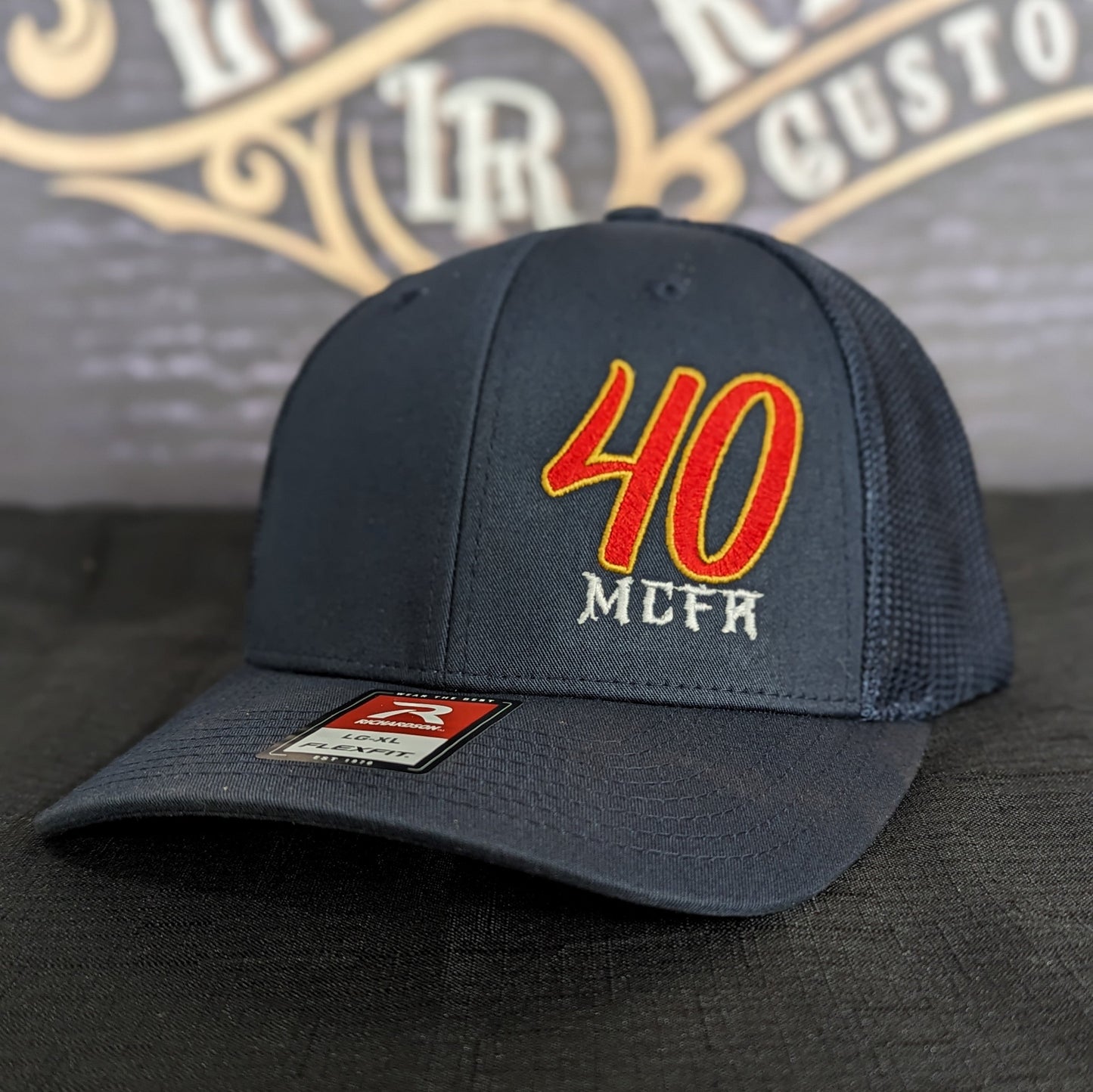 Custom embroidered firefighter hat with bold stitching, structured fit, and premium Richardson snapback design