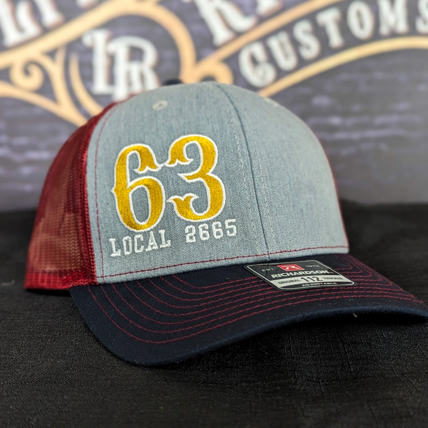 Custom embroidered firefighter hat with bold stitching, structured fit, and premium Richardson snapback design