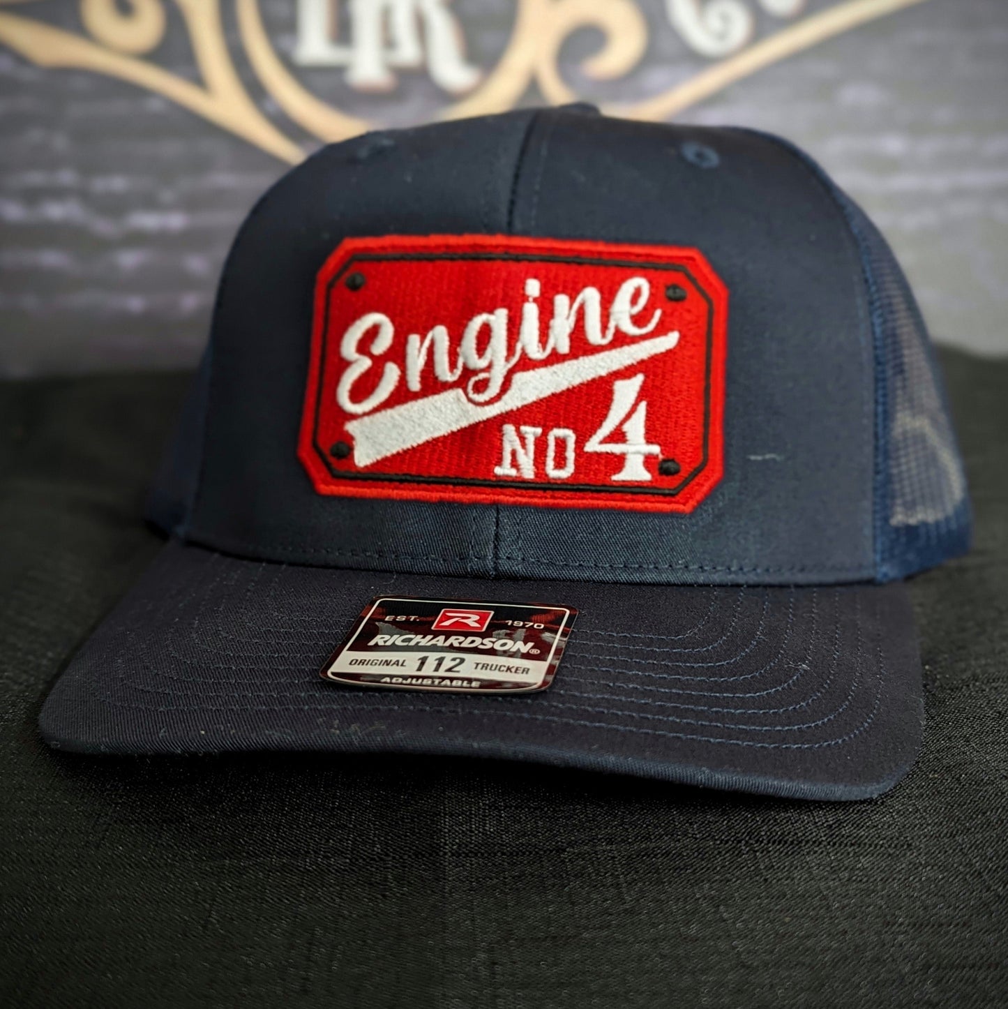 Custom embroidered firefighter hat with bold stitching, structured fit, and premium Richardson snapback design