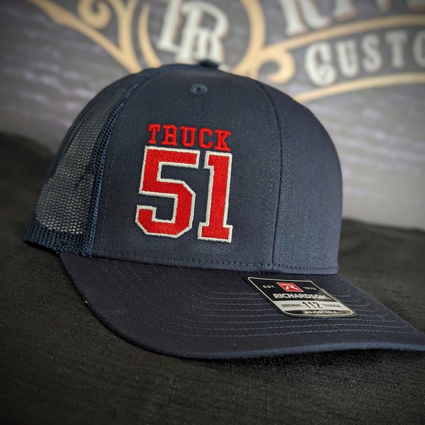 Custom embroidered firefighter hat with bold stitching, structured fit, and premium Richardson snapback design