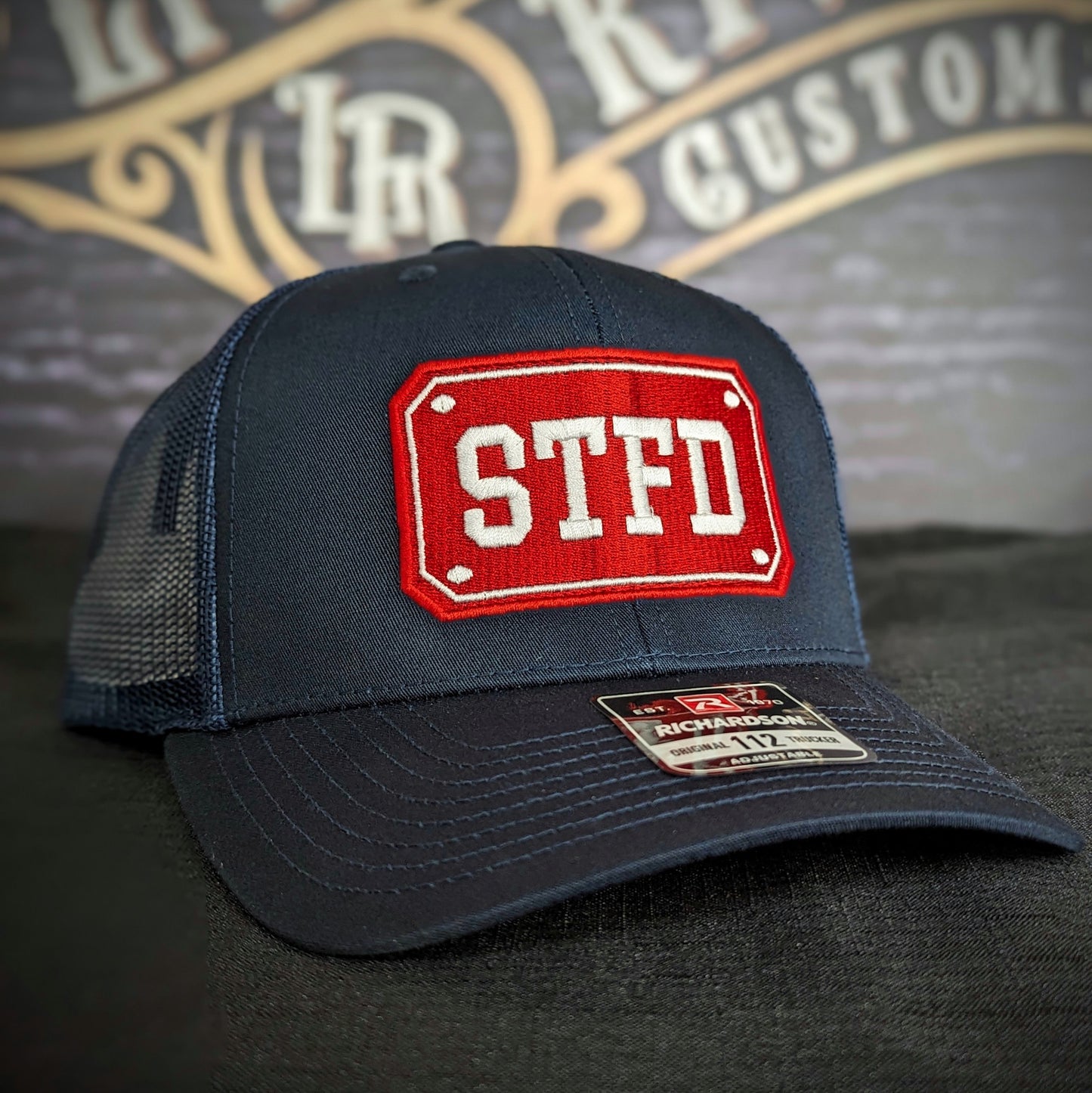 Custom embroidered firefighter hat with bold stitching, structured fit, and premium Richardson snapback design