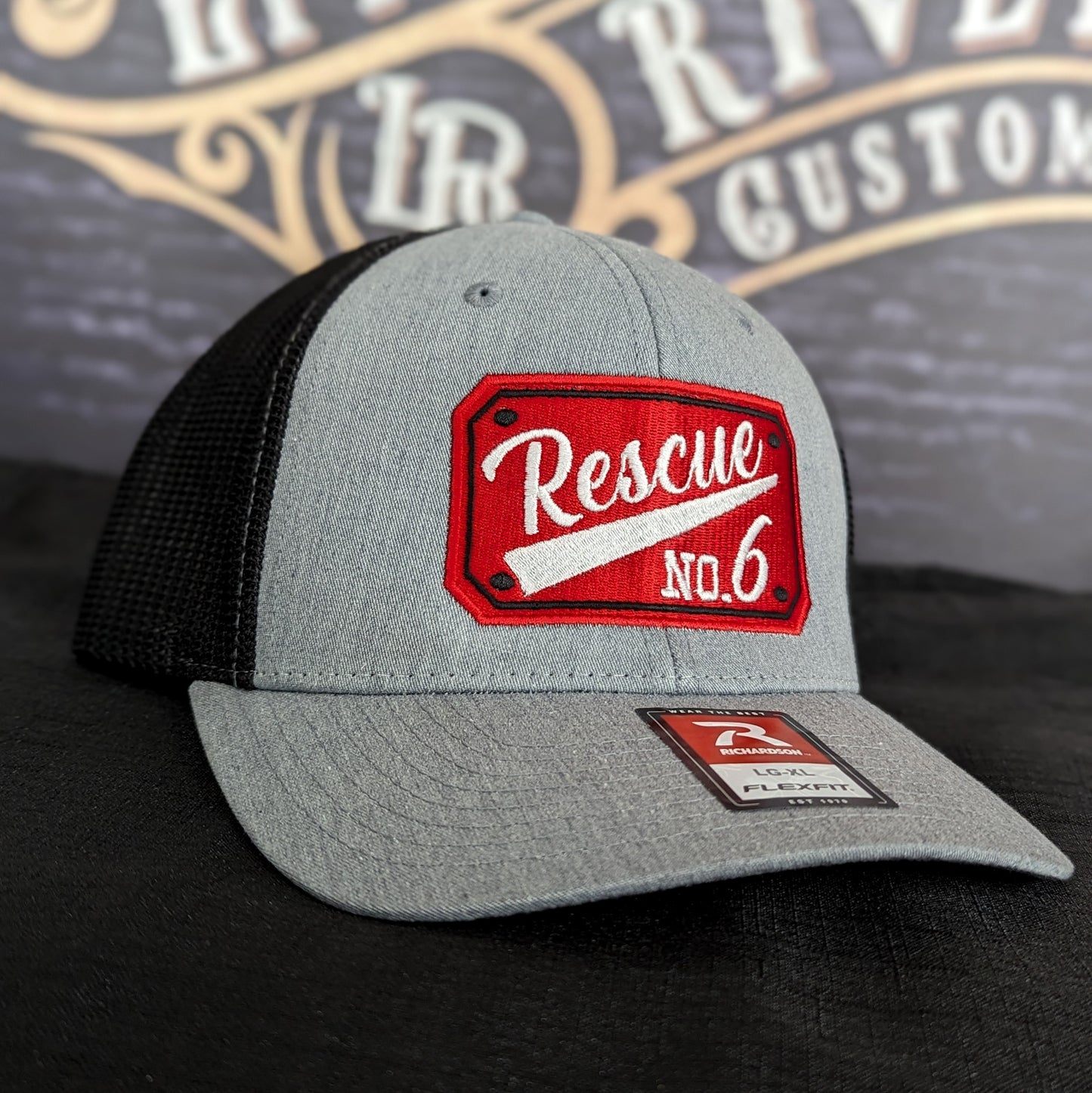 Custom embroidered firefighter hat with bold stitching, structured fit, and premium Richardson snapback design