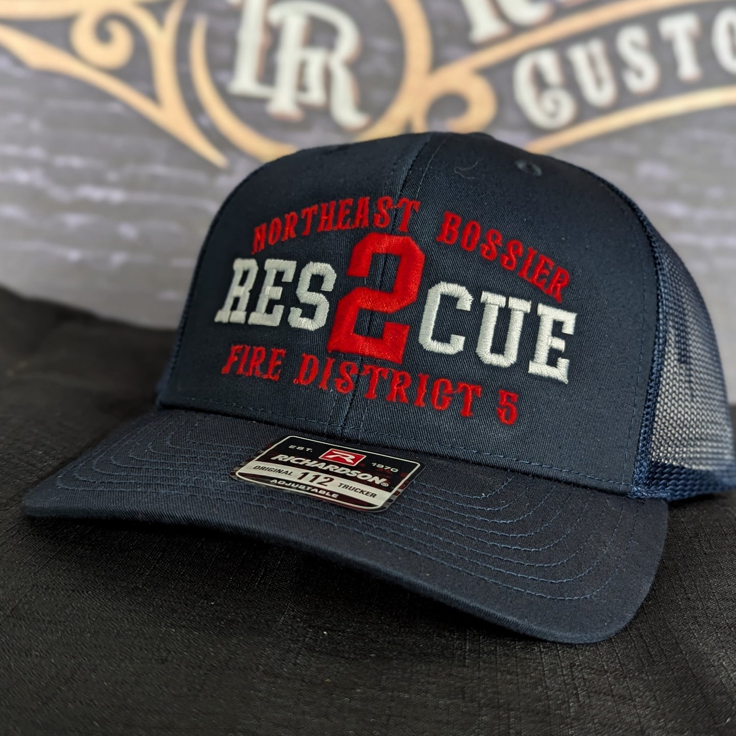 Custom embroidered firefighter hat with bold stitching, structured fit, and premium Richardson snapback design