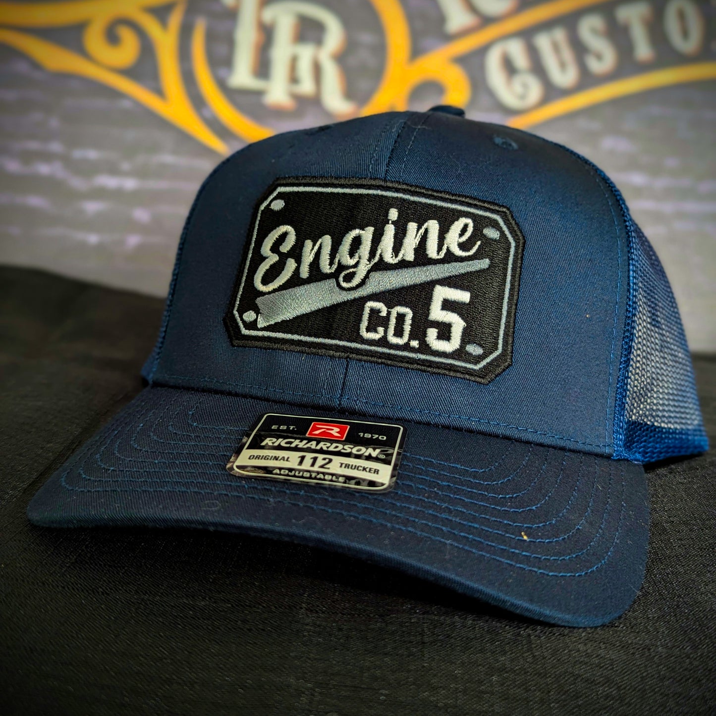 Custom embroidered firefighter hat with bold stitching, structured fit, and premium Richardson snapback design