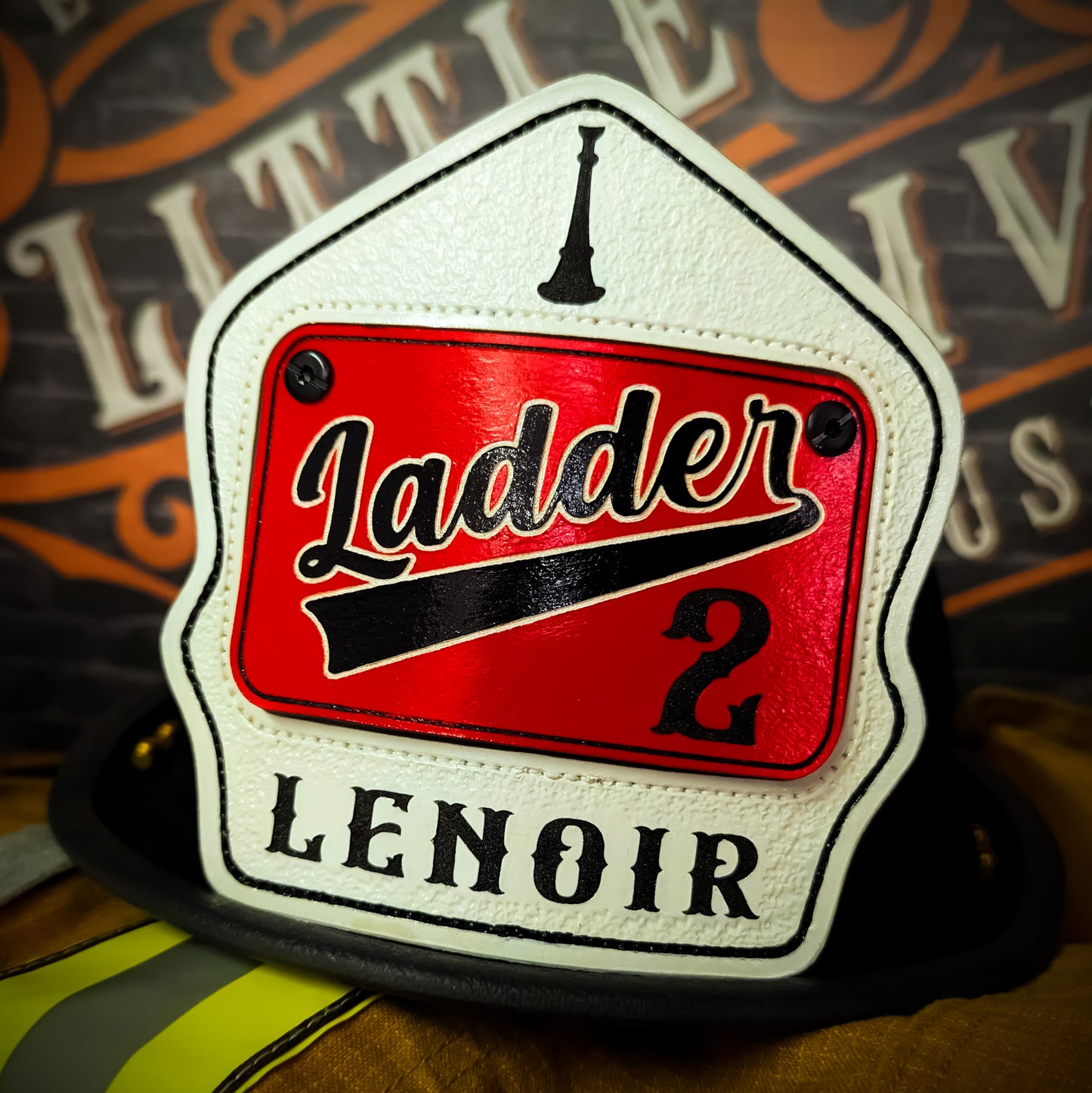Custom passport-style firefighter helmet shield featuring a traditional layout with center number, name, and optional rank or assignment line