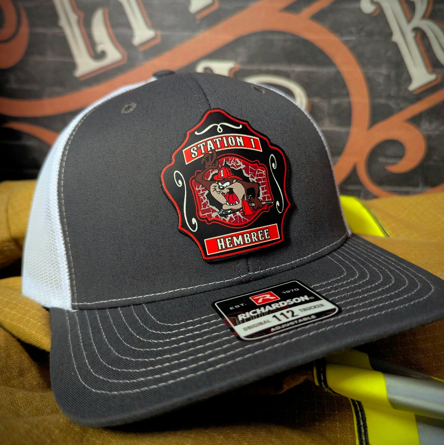 Custom firefighter hat for Western Taney Station 1. Features bold department artwork on a full-grain leather patch. Built for comfort, pride, and daily wear.