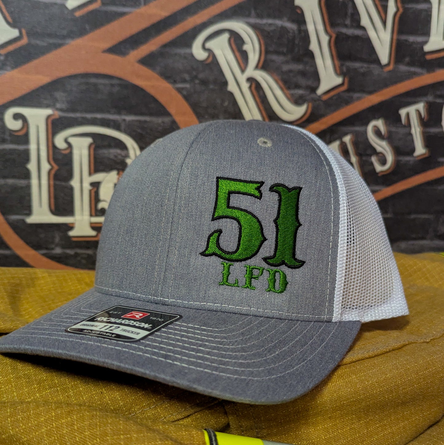 Custom embroidered firefighter hat with bold stitching, structured fit, and premium Richardson snapback design