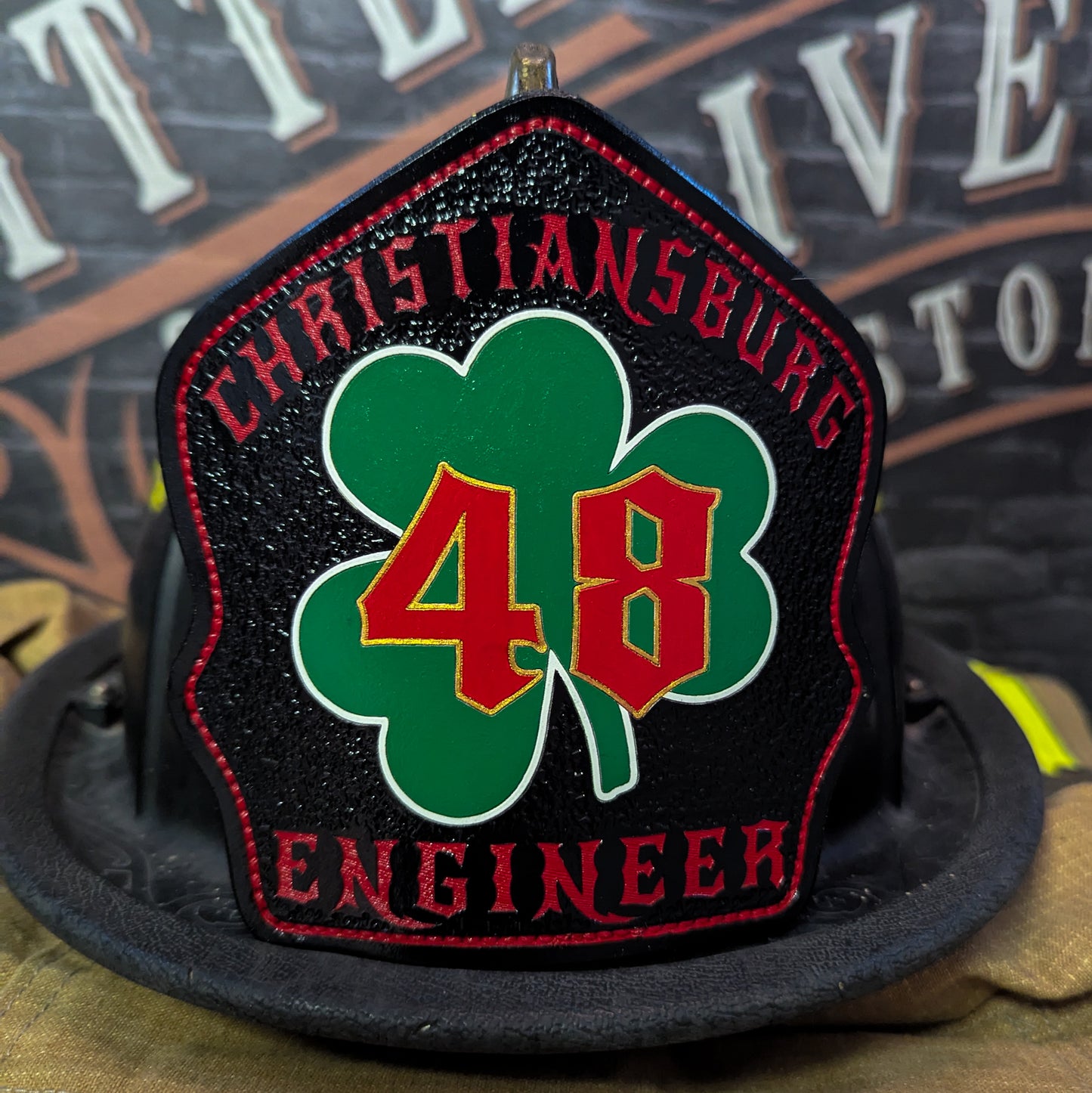 Custom Leather fire helmet shield with department name, rank, and company number