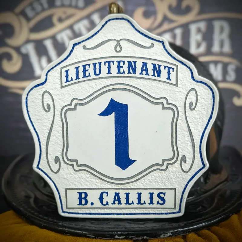 Standard Issue custom leather firefighter helmet shield for Lieutenant in white with blue numbers, blue panels, and gray trim accents.