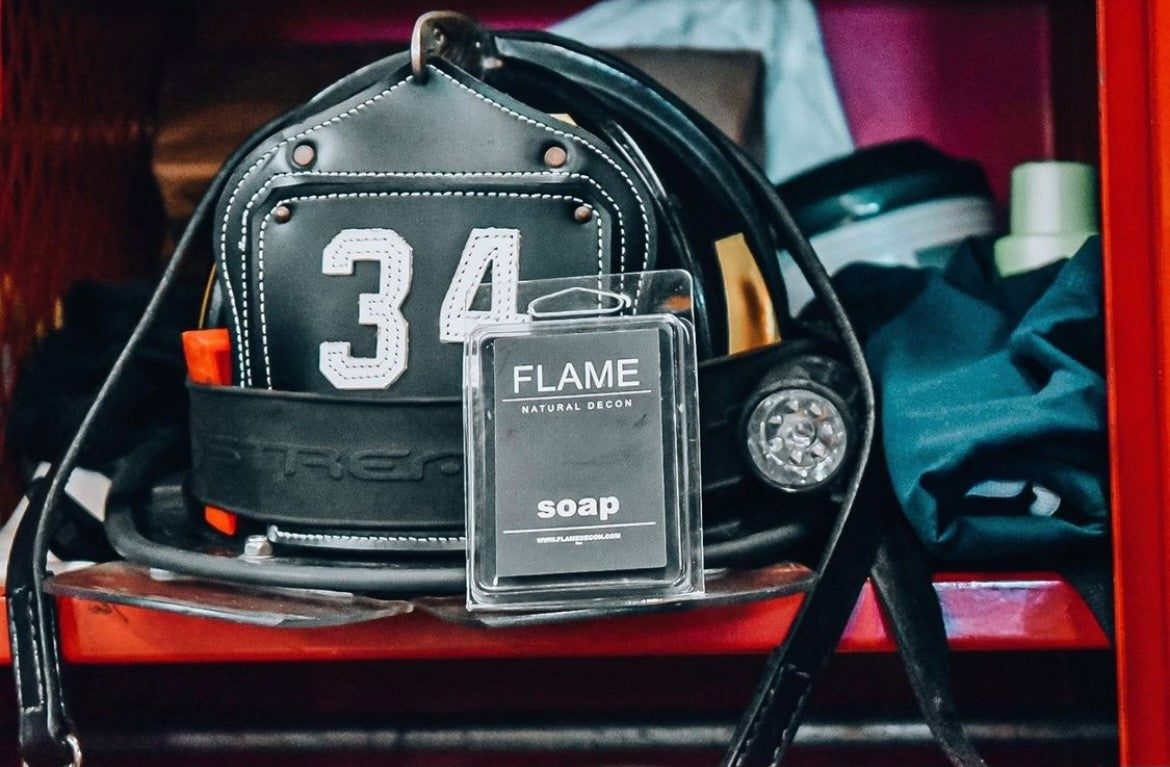 Firefighter using Flame Decon soap and shampoo after fireground exposure