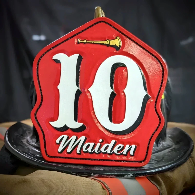 Custom leather firefighter helmet shield showing beveled and hand tooled details