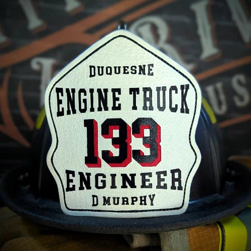 Classic leather firefighter helmet shield with bold number and colors