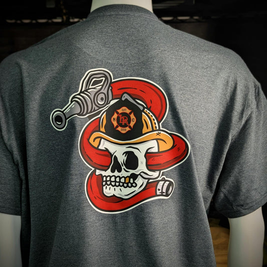 Back of firefighter shirt – skull in helmet wrapped with red fire hose and nozzle, custom fire service design by Little River Customs