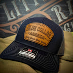 Hat with leather patch reading “Blue Collar America – Dirty Hands, Clean Money” on Richardson 112 hat