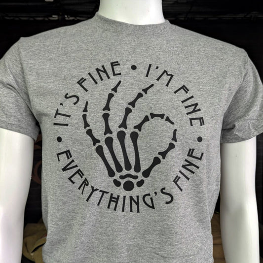 Gray t-shirt with black skeleton hand and “It’s Fine. I’m Fine. Everything’s Fine” text – dark humor graphic tee for firefighters or burnout moods
